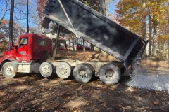 New rock is delivered in anticipation of the crane and bridge arrival.
