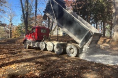 New rock is delivered in anticipation of the crane and bridge arrival.