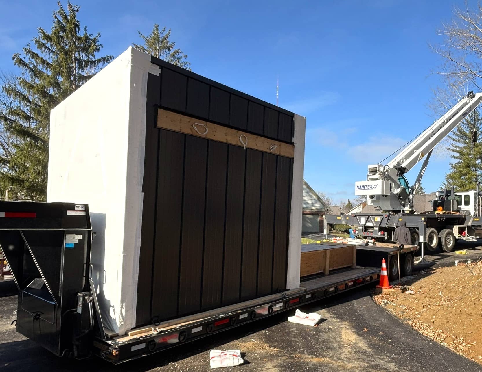 Close-up of DropStructures logo on the side of the prefabricated gatehouse delivery vehicle.